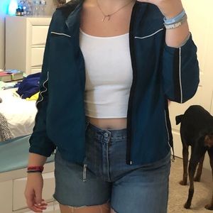 blue and black windbreaker.